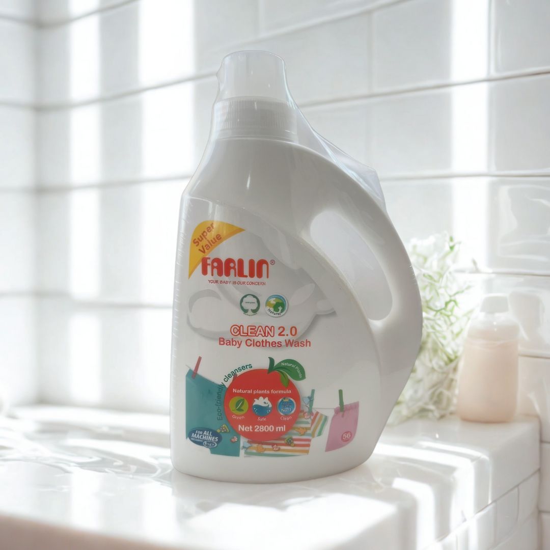 White bottle of Farlin baby clothes wash on a white tiled bathroom counter