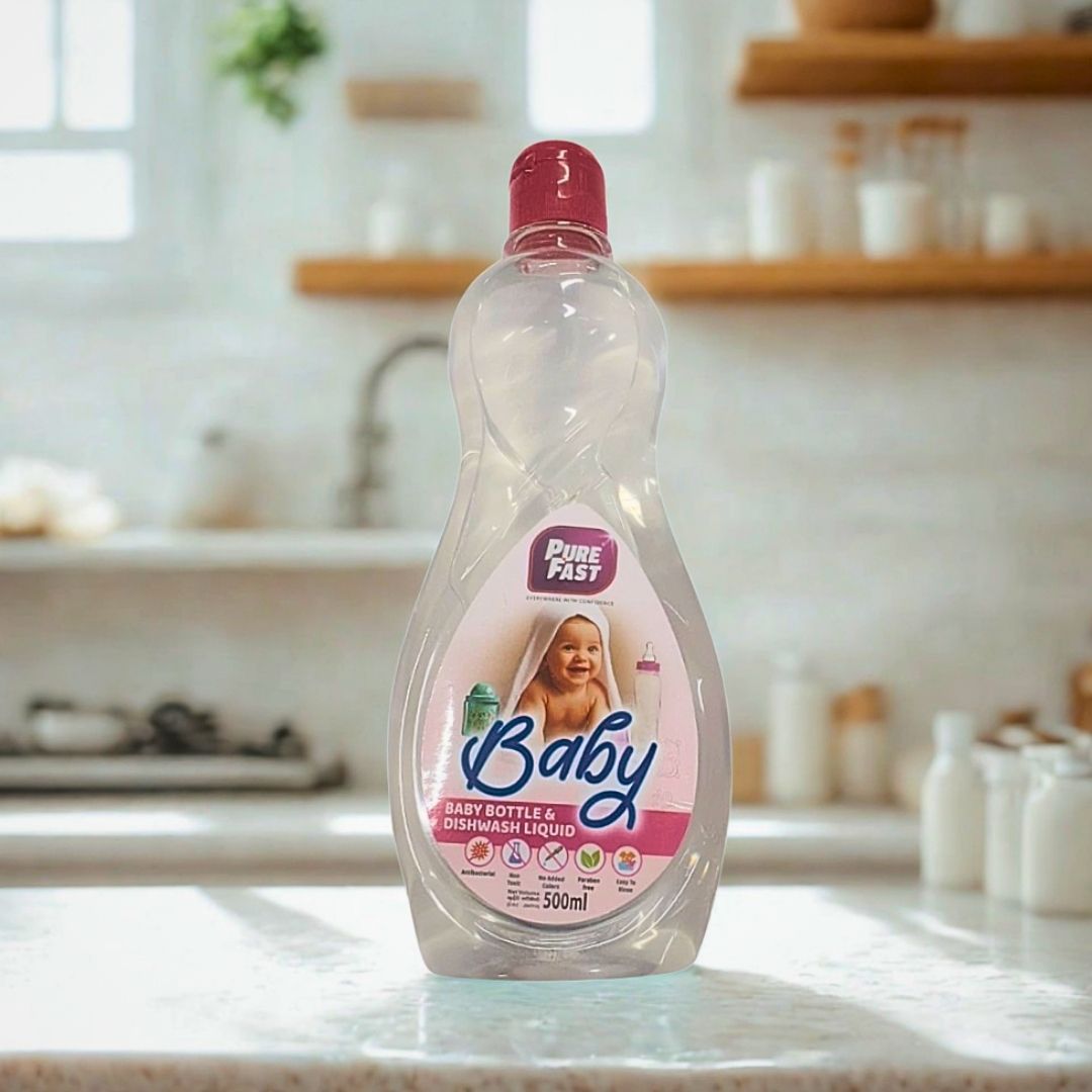 Bottle of Pure Fast Baby bottle and dishwash liquid on a kitchen counter.